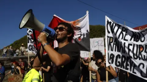 France-Wide Walkouts Erupt Against Spending Cuts